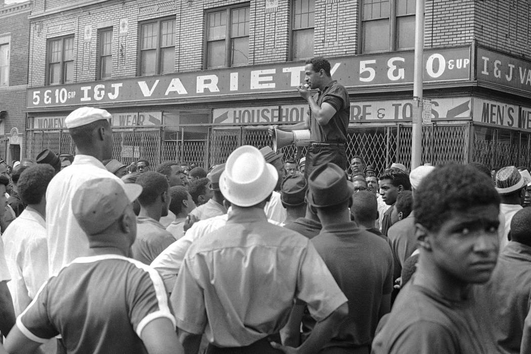 FILE - In a July 23, 1967 file photo, Congressman John Conyers, Detroit Democrat, uses a bullh ...