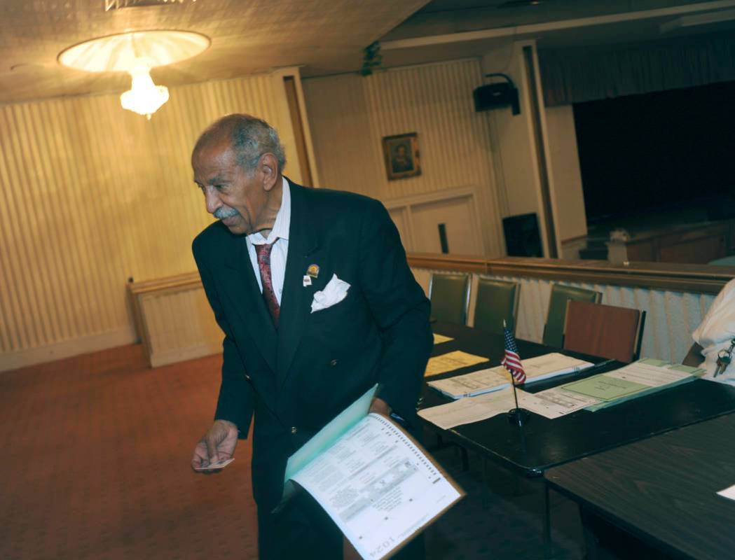 FILE - In a Tuesday, Aug. 5, 2014 file photo, Congressman John Conyers votes at Word of Power M ...