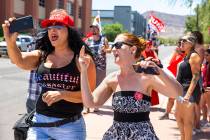 Counter protester Jennifer Harrison, left, with the AZ Patriots group, live-streams as Tamara T ...