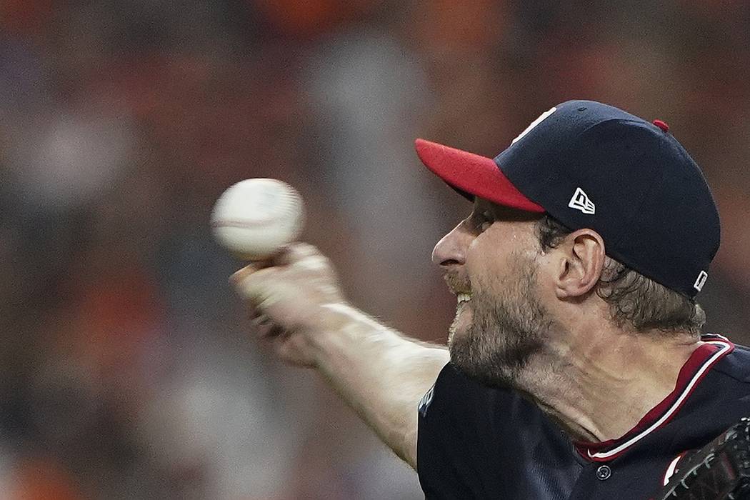 Washington Nationals starting pitcher Max Scherzer throws during the fifth inning of Game 1 of ...