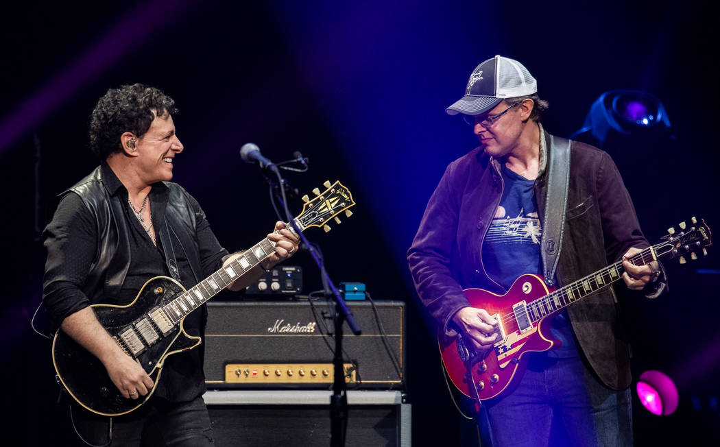 Neal Schon and Joe Bonamassa are shown at Journey's show at the Colosseum at Caesars Palace on ...