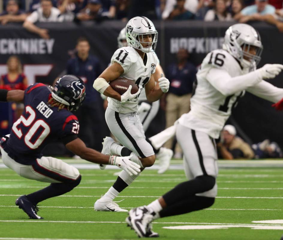 Oakland Raiders wide receiver Trevor Davis (11) runs after making a catch as Houston Texans str ...