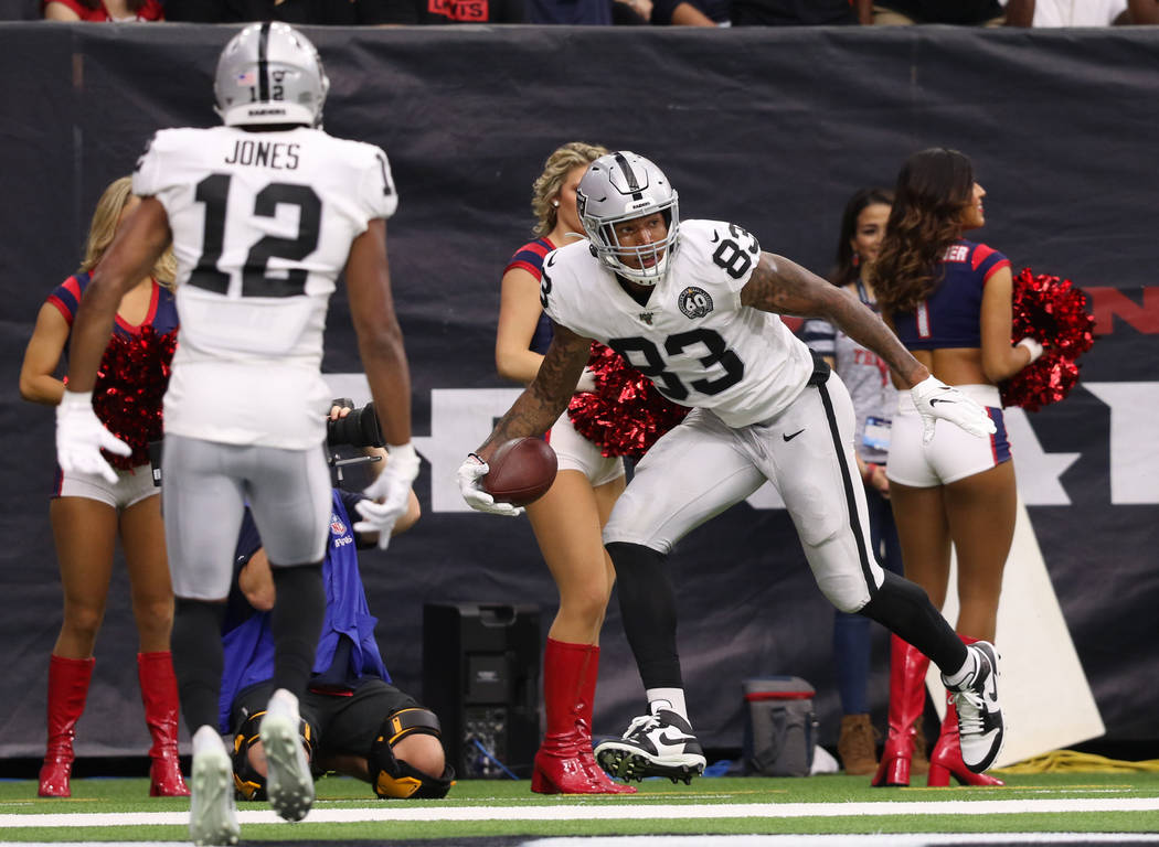 Oakland Raiders tight end Darren Waller (83) celebrates his touchdown as wide receiver Zay Jone ...