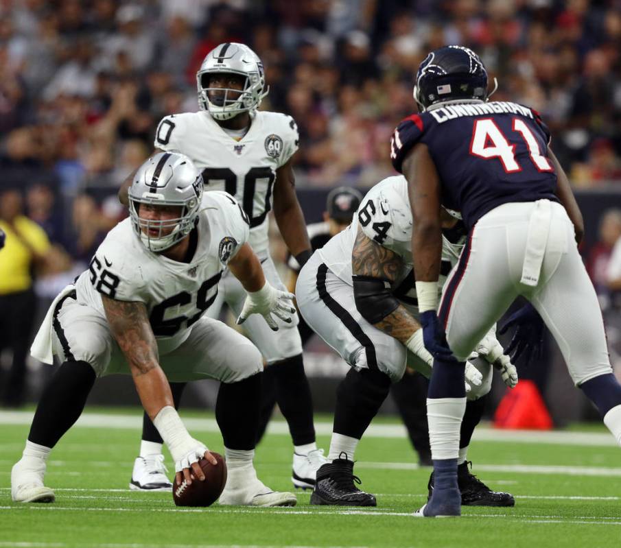 Oakland Raiders offensive tackle Andre James (68) prepares to hike the football after replacing ...