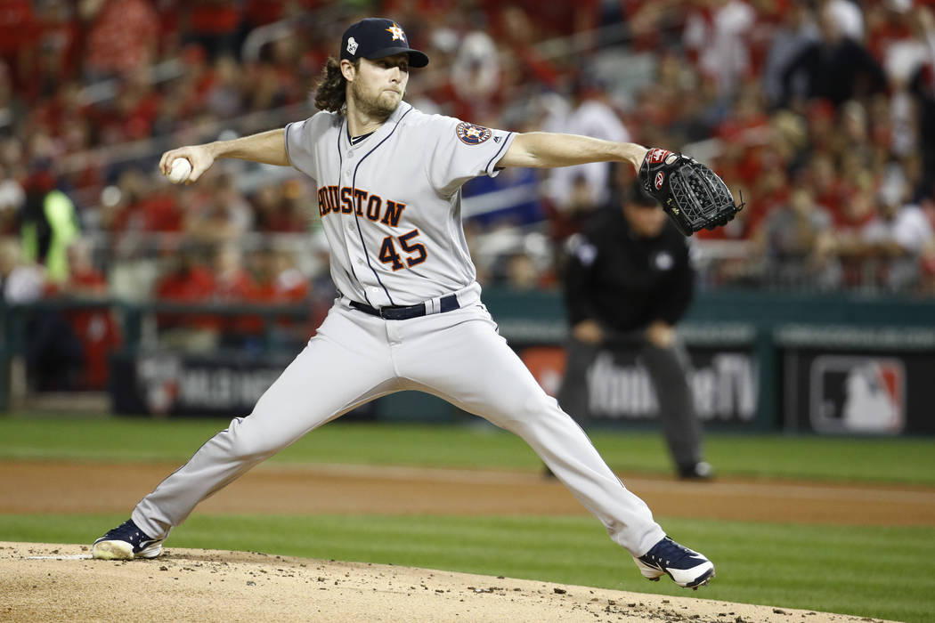 Houston Astros starting pitcher Gerrit Cole throws against the Washington Nationals during the ...