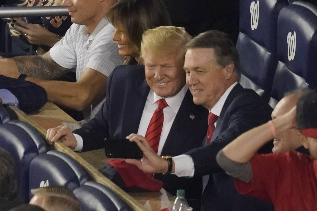 Sen. David Perdue, R-Ga., takes a selfie with President Donald Trump during the seventh inning ...
