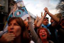 Supporters of center-left Peronist presidential candidate Alberto Fernández and running ma ...