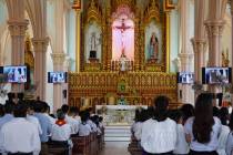 Priest Nguyen Duc Vinh leads a Sunday Mass at Phu Tang church in Yen Thanh district, Nghe An pr ...