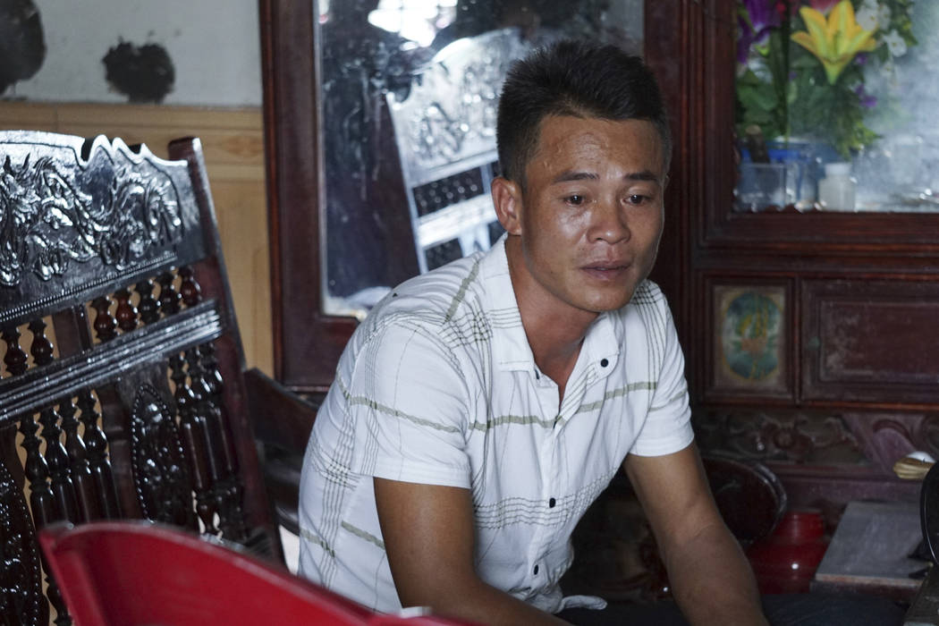 Vo Ngoc Chuyen, brother of Vo Ngoc Nam, speaks to media at his home in Yen Thanh district, Nghe ...