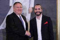 U.S. Secretary of State Mike Pompeo, left, shakes hands with El Salvador's President Nayib Buke ...