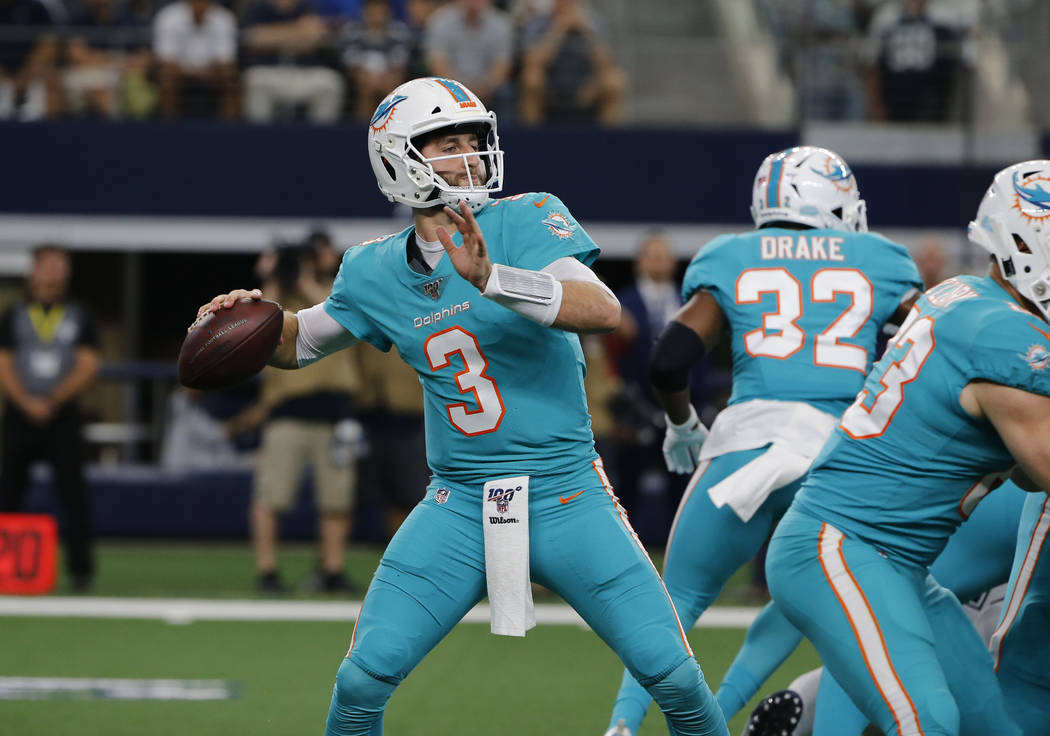 Miami Dolphins quarterback Josh Rosen (3) throws against the Dallas Cowboys during a NFL footba ...