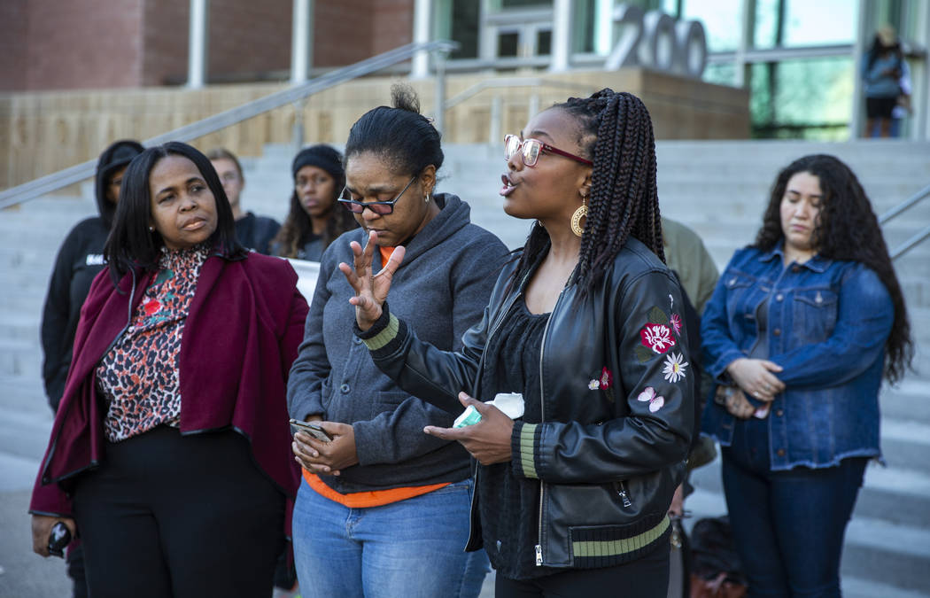 Marcie Wells, right, speaks during the National Day of Outrage rally outside the Regional Justi ...