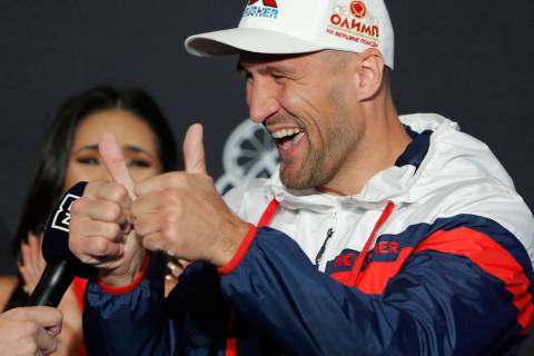 Sergey Kovalev motions to the crowd during a ceremonial arrival for an upcoming boxing match Tu ...