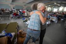 In this Sunday, Oct. 27, 2019, photo, Red Cross volunteer Barbara Wood gives a hug to a Kincade ...