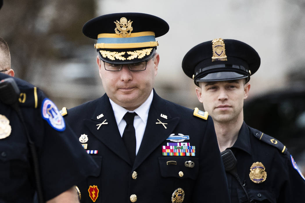 Army Lt. Col.l Alexander Vindman, left, a military officer at the National Security Council, ce ...