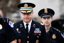 Army Lt. Col.l Alexander Vindman, left, a military officer at the National Security Council, ce ...