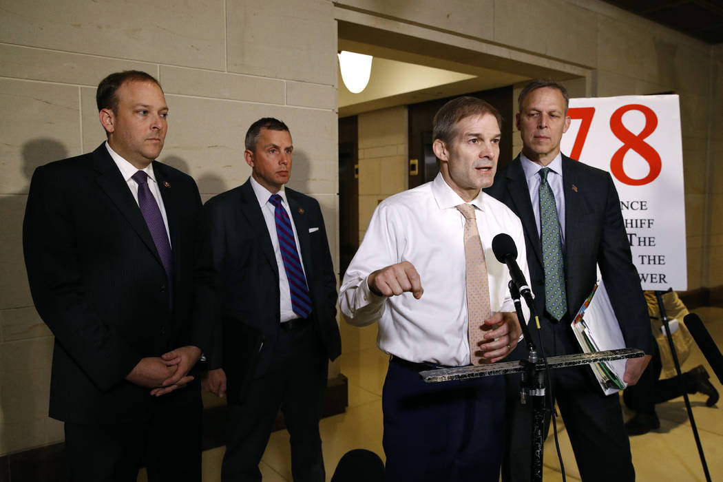 Rep. Jim Jordan, R-Ohio, second from right, speaks to members of the media after National Secur ...