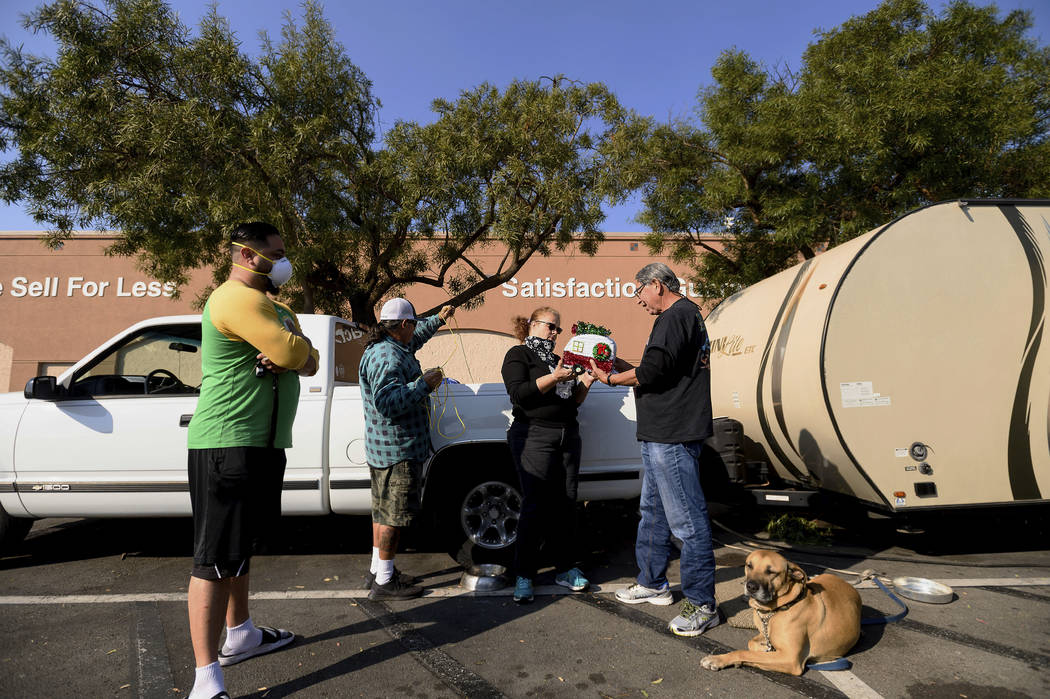 Kincade Fire evacuee Larisa Figueroa gets a gift trailer from Gilbert Lemus while camped in a R ...