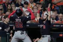 Washington Nationals' Juan Soto celebrates his home run with teammate Alex Bregman uring the fi ...