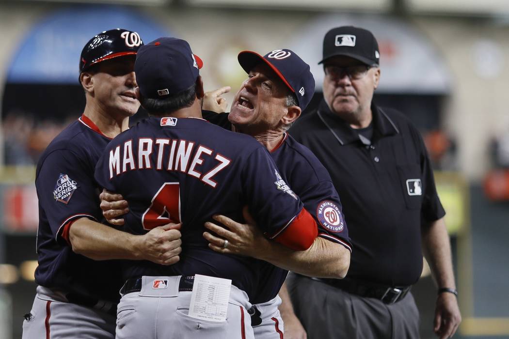 Washington Nationals manager Dave Martinez has to be restrained after being ejected for arguing ...
