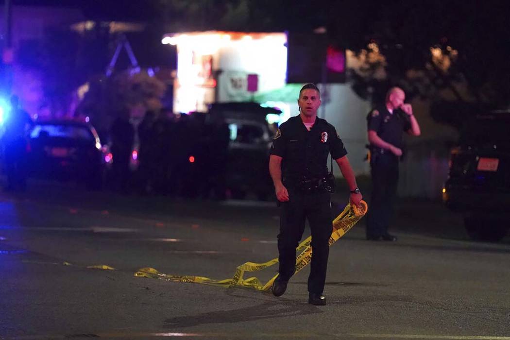 Police close off the scene of a shooting on E. 7th Street in Long Beach on Wednesday, Oct. 30, ...