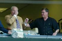 Seattle Mariners' radio announcer Dave Neihaus, left, wipes his eyes as Ron Fairly, right, reac ...