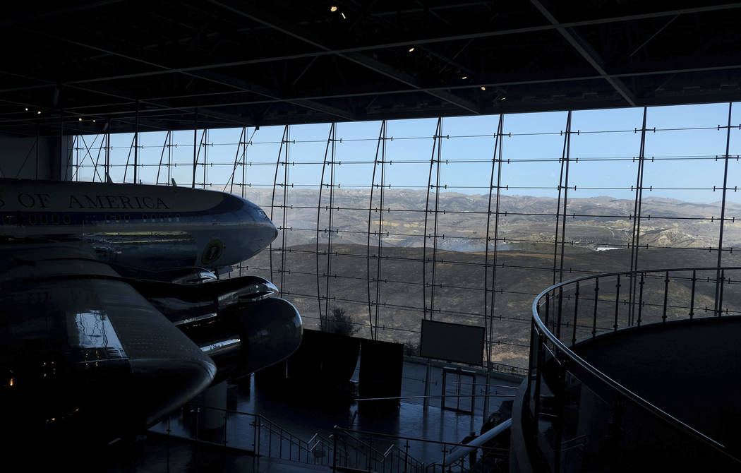 The burned hillsides surround the Ronald Reagan Presidential Library on Wednesday, Oct. 30, 201 ...