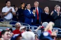 President Donald Trump, third from right, accompanied by first lady Melania Trump, second from ...