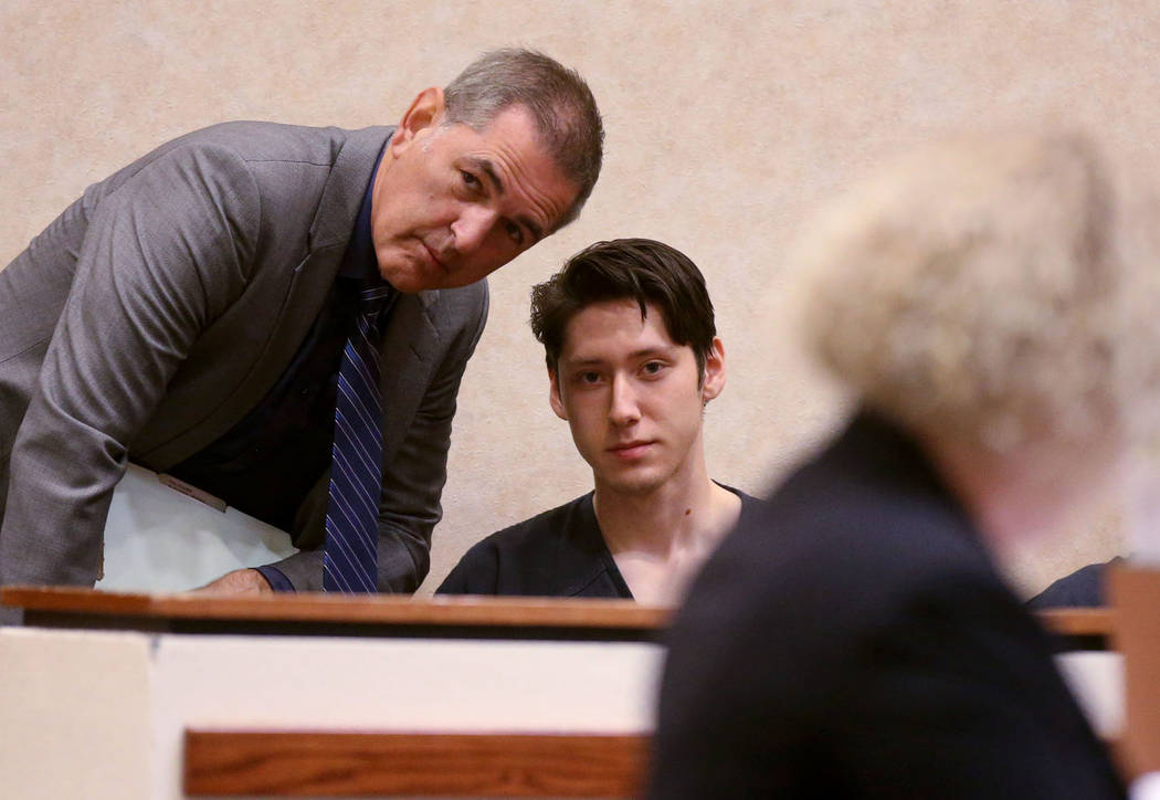 Giovanni Ruiz, 21, second from left, talks to his attorney, Gabriel Grasso, while waiting to ap ...