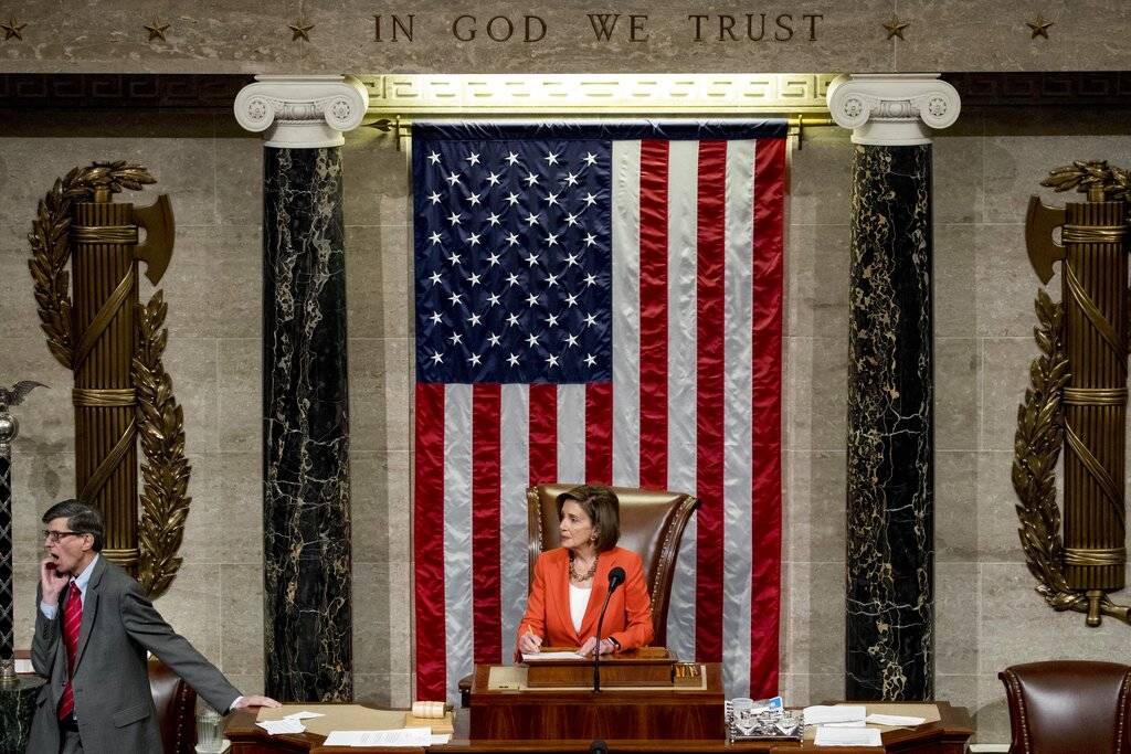House Speaker Nancy Pelosi of Calif. is seen at her chair as House members vote on a resolution ...