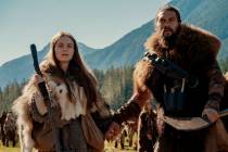 This image released by Apple TV Plus shows Jason Momoa, right, and Hera Hilmar in a scene from ...