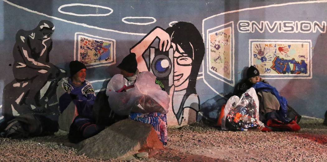Clients try to keep warm at Courtyard Homeless Resource Center on Thursday, Oct. 31, 2019, in L ...