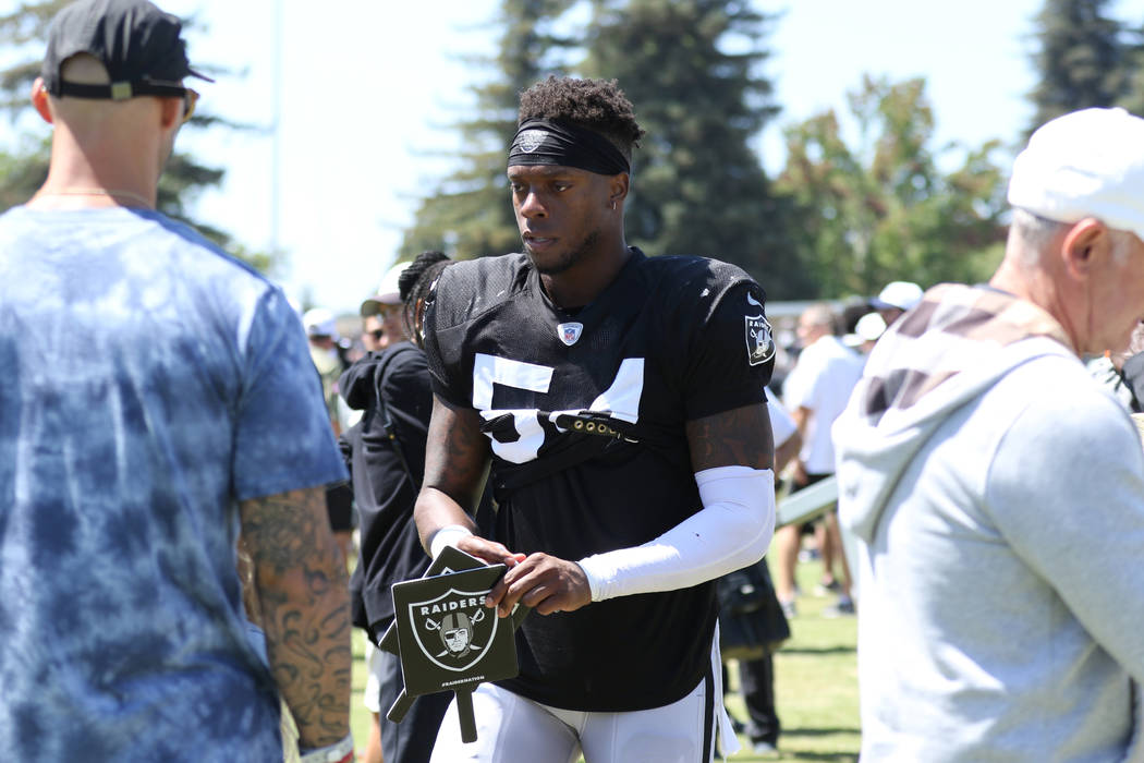 Oakland Raiders inside linebacker Brandon Marshall (54) signs autographs for fans after the NFL ...