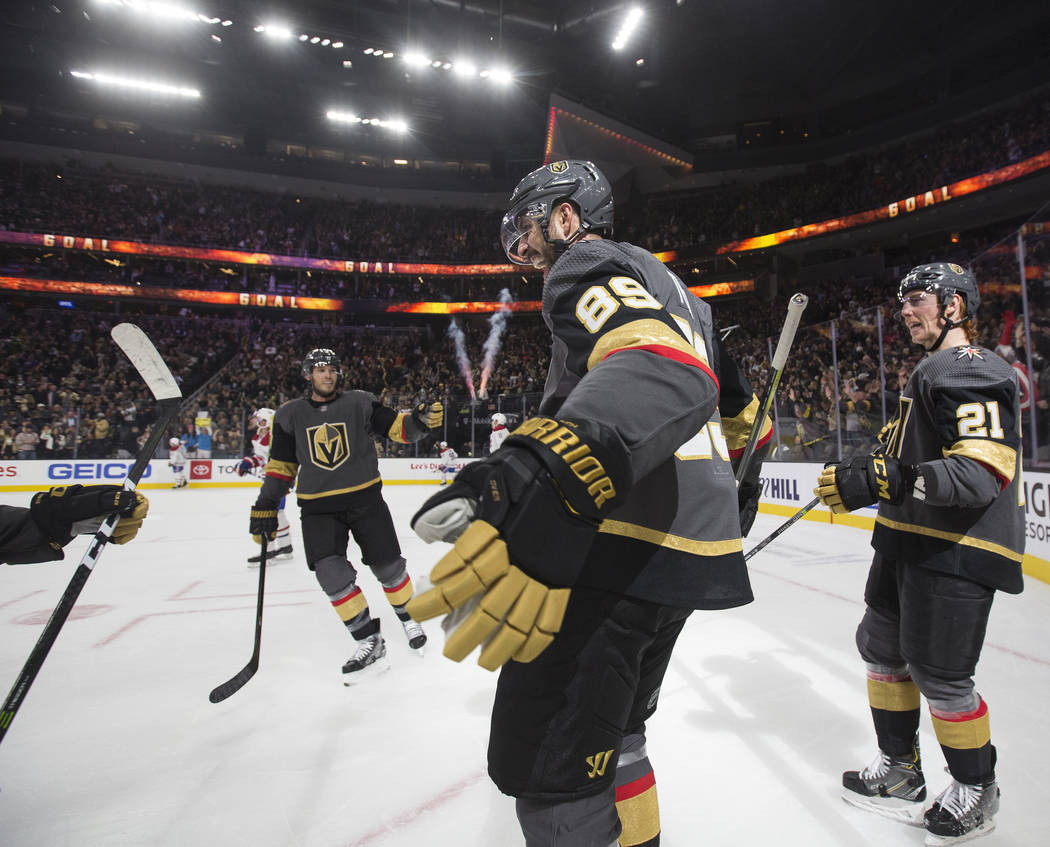 Vegas Golden Knights right wing Alex Tuch (89) celebrates his first period goal with Vegas Gold ...