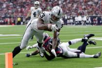 Oakland Raiders tight end Darren Waller (83) scores a touchdown against the Houston Texans afte ...