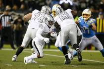 Oakland Raiders running back Josh Jacobs (28) runs against the Los Angeles Chargers during an N ...