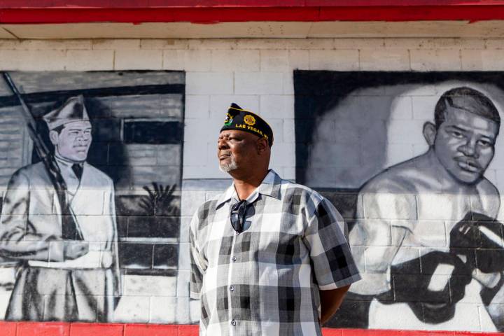 Navy veteran Kevin Felder stands amongst murals painted at American Legion Post 10 in Las Vegas ...