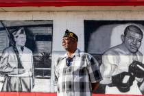 Navy veteran Kevin Felder stands amongst murals painted at American Legion Post 10 in Las Vegas ...