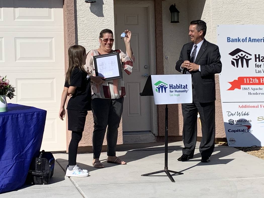 A Las Vegas single mom received the keys to her brand-new Habitat for Humanity home during an O ...