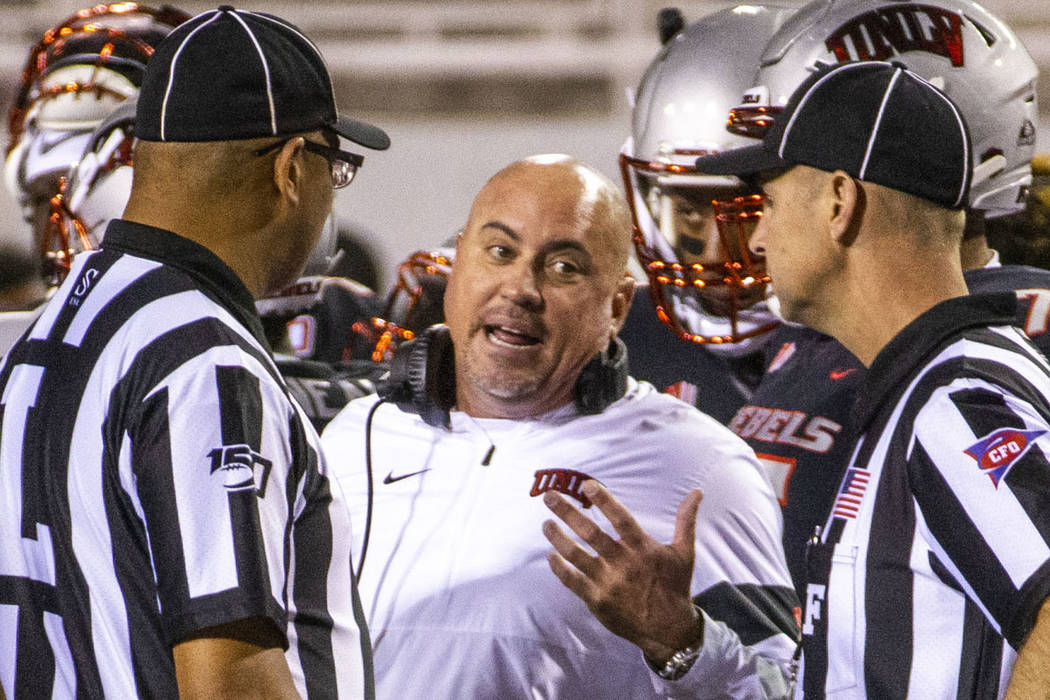 UNLV Rebels head coach Tony Sanchez pleads his case for a call against the San Diego State Azte ...