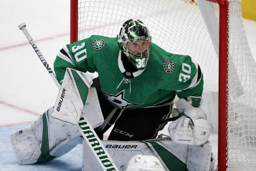 Dallas Stars goaltender Ben Bishop (30) minds the net during an NHL hockey game against the Pit ...