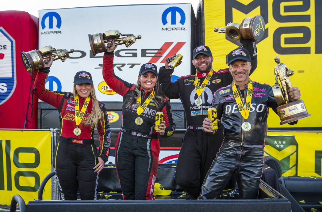 (From left) Race winners Brittany Force, Erica Enders, Matt Hagan and Matt Smith celebrate hold ...