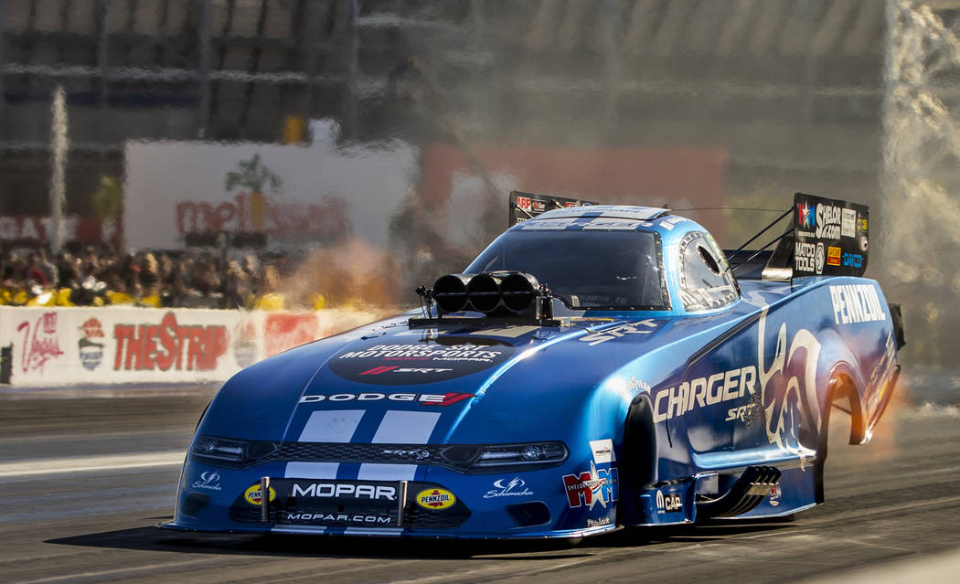 Funny car racer Matt Hagan takes the lead in the second round during the Dodge NHRA Nationals a ...