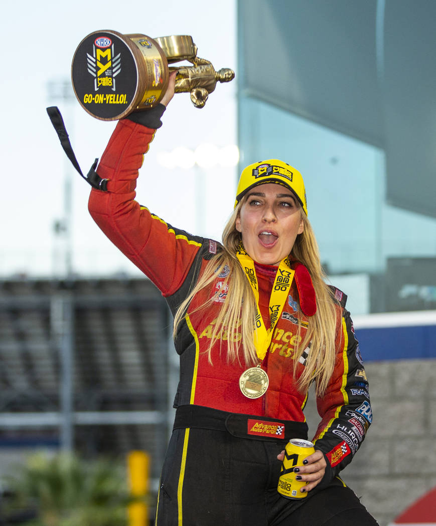 Top Fuel racer Brittany Force celebrates her win in the final round of the Dodge NHRA Nationals ...