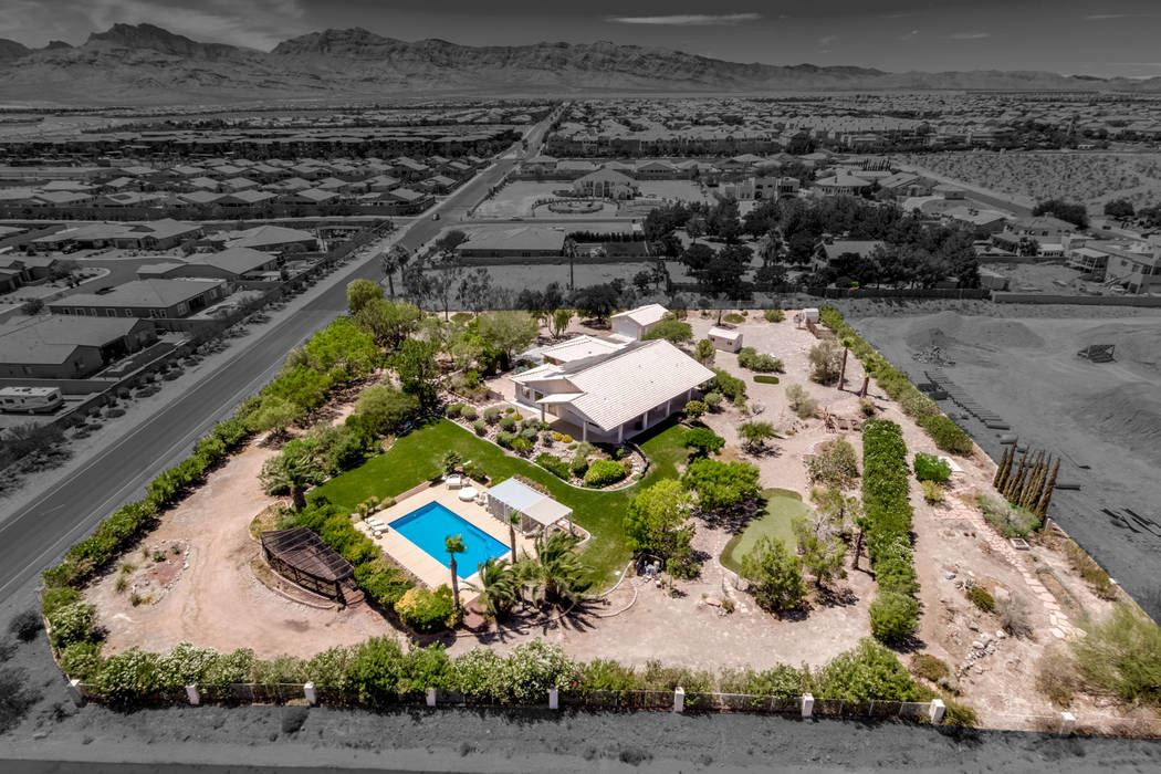 This 2.1-acre Las Vegas estate has parklike grounds, solar power and its own well. It's on the ...