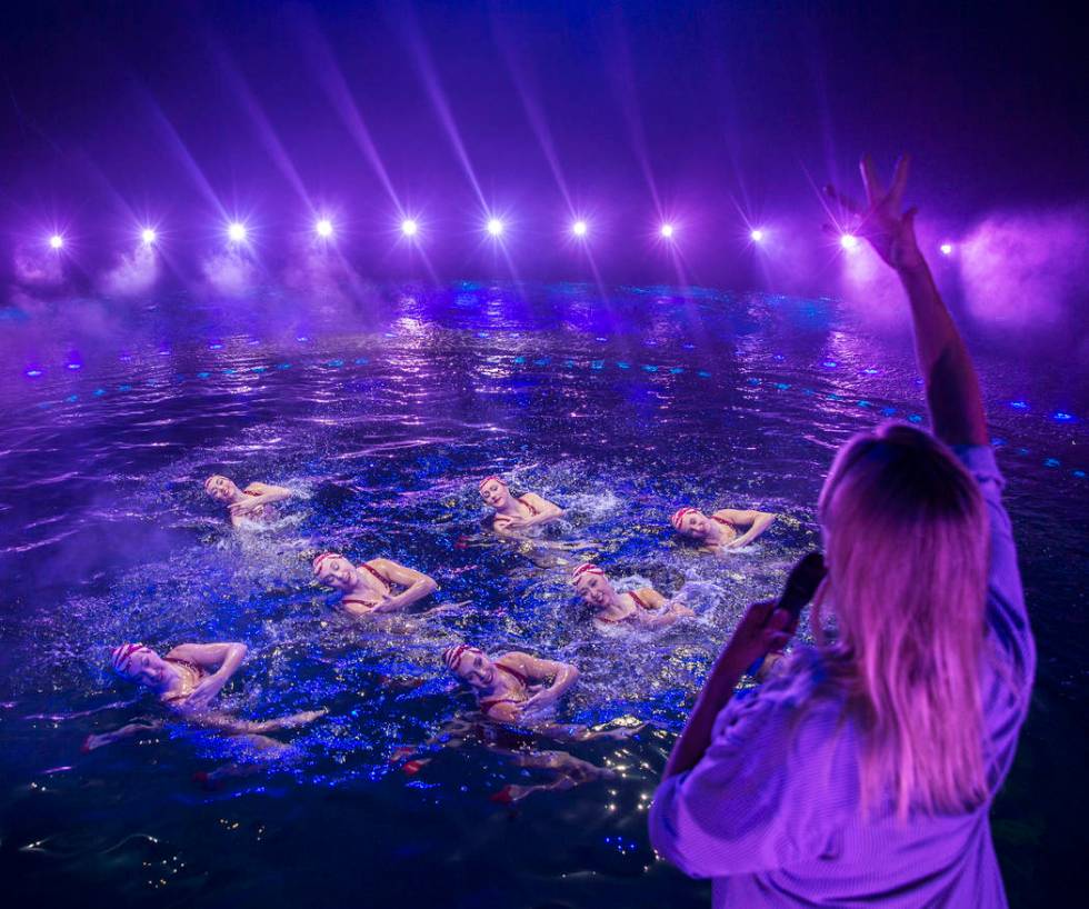 Aquatic coach and choreographer Dacha Nedorezova, bottom/right, gives instruction to synchroniz ...