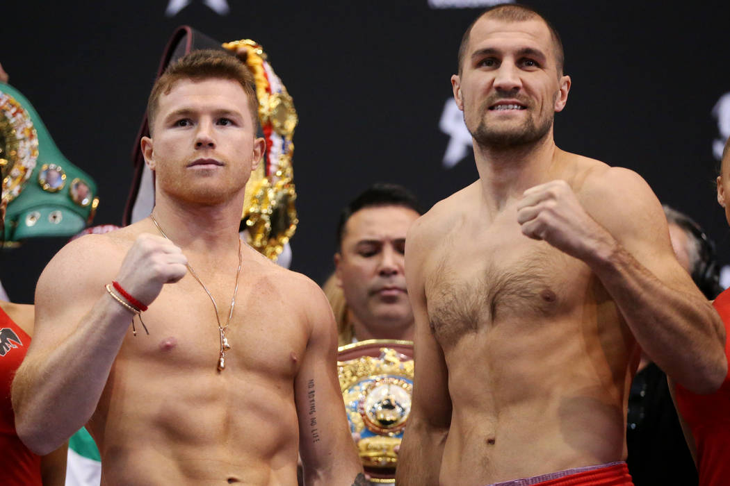 Saul "Canelo" Alvarez, left, and Sergey Kovalev pose during a weigh-in event at the M ...