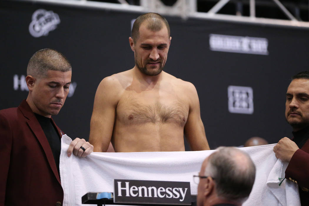 Sergey Kovalev stands on the scale during a weigh-in event at the MGM Grand Garden Arena in Las ...
