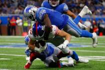 Detroit Lions middle linebacker Jarrad Davis (40) tackles New York Giants tight end Rhett Ellis ...