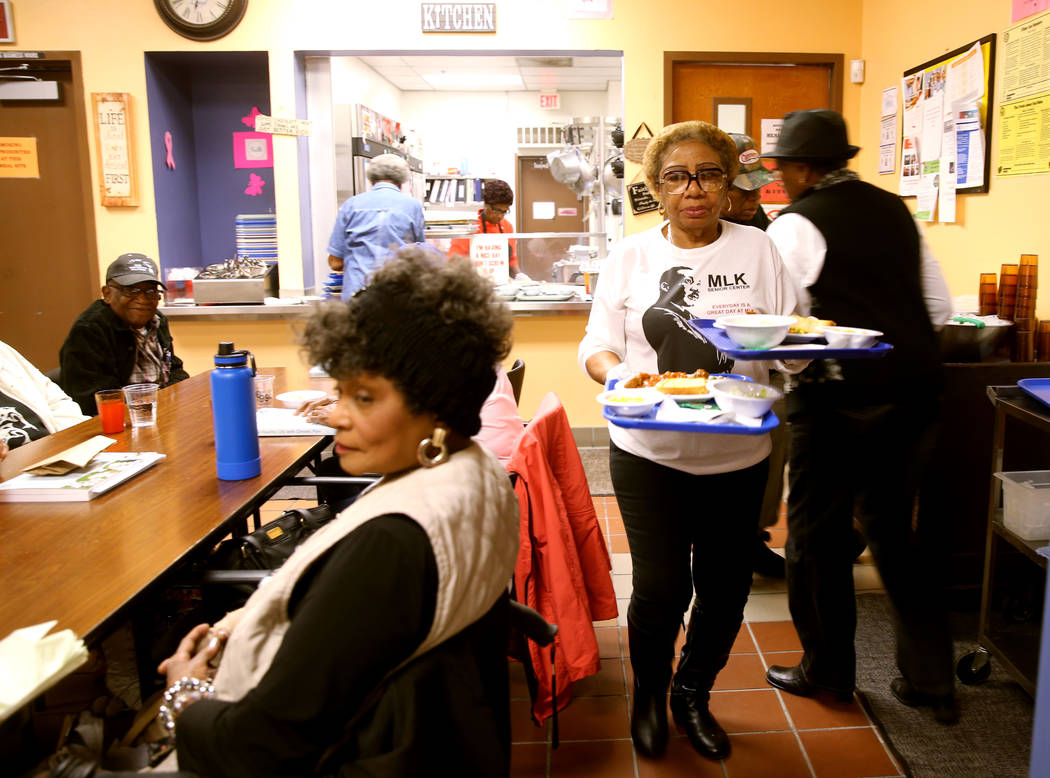 Mary Davis serves lunch at Martin Luther King Jr. Senior Center in North Las Vegas Wednesday, O ...